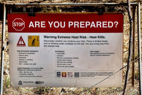 Warning sign in Bell Gorge warning of extreme heat and safety measures, Bell Gorge, Australia