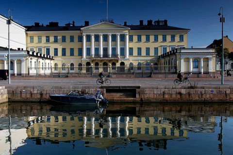 Presidential Palace on Kauppatori in Helsinki with majestic architecture and water reflections,