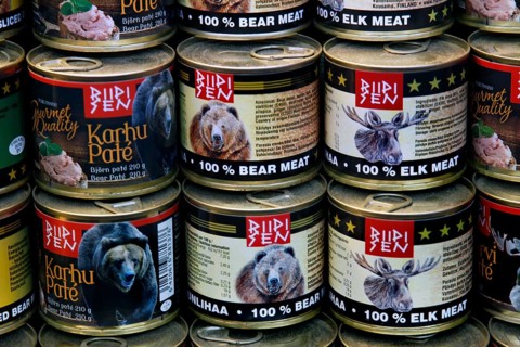 Interior view of a market hall with detailed canned goods with bear meat labels, Helsinki, Finland