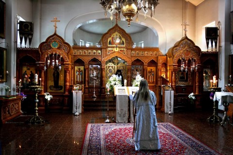 Interior view of Uusi Valamo monastery in Heinävesi during a church service with an impressive