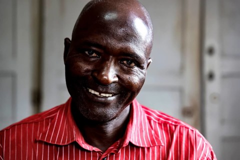 Smiling employee named Honoré in a men's psychiatric ward in Bouaké, Bouaké, Nimbo, Côte d'Ivoire