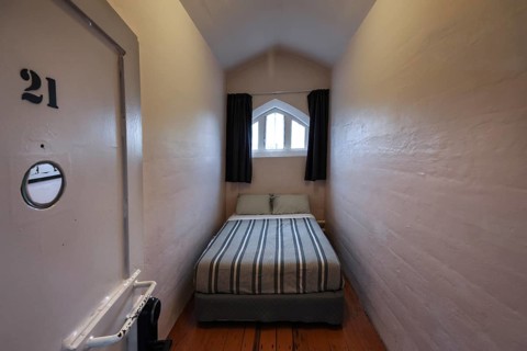 Simple cell as accommodation in the former prison in Christchurch, Christchurch, Canterbury, New