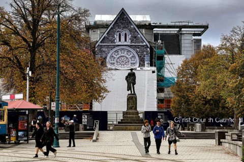 Cathedral and monument at Cathedral Square in Christchurch with passers-by, Christchurch,