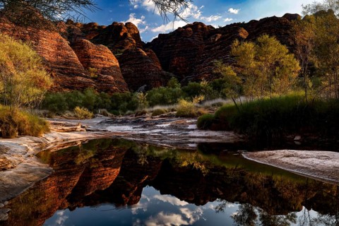 Fascinating rock formations in Purnululu NP reflected in a silent waterhole, Purnululu National