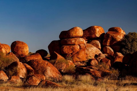 Dense collection of impressive rocks under bright blue sky, Devil's Marbles, Northern Territory,