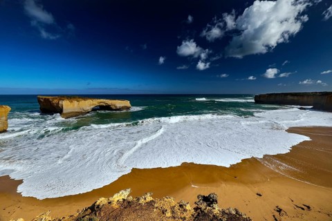 The London Bridge coastal formation on the Great Ocean Road with impressive rocks and waves, Great