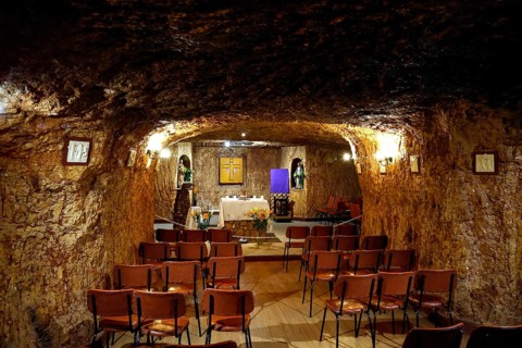 Underground chapel in Coober Pedy with standing pews and altar table, Coober Pedy, South Australia,