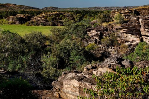 Wide rocky landscape with lush vegetation at Nardab Lookout, Ubirr, Northern Territory, Australia