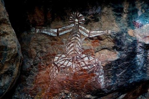 Aboriginal rock painting depicting a mystical figure with outstretched arms, Nourlangie, Northern