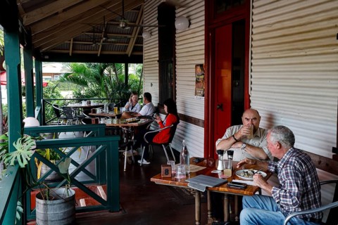 Visitors enjoy drinks and snacks on the veranda of Matso's Broome Brewery, Broome, Western