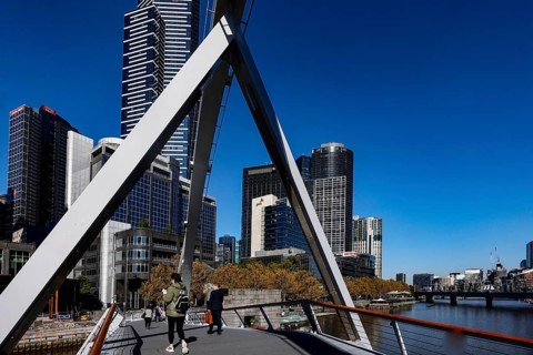 View of Melbourne's skyline from Sandridge Bridge under clear sky, Melbourne, Victoria, Australia