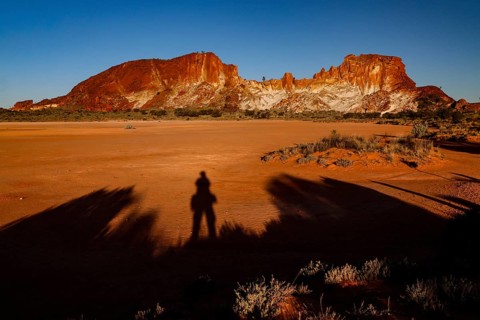 Dark shadows against the contrasting landscape of Rainbow Valley when the sun is low, Rainbow