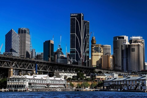 Sydney's Walsh Bay with impressive skyline and distinctive bridge over sparkling water, Sydney, New
