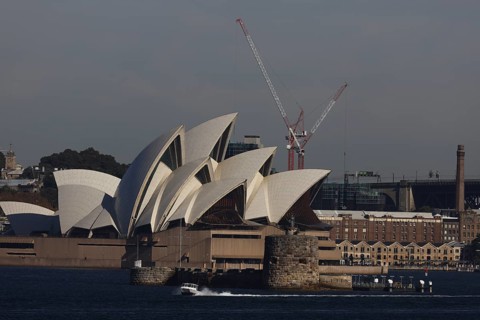 View of Sydney Opera House with a crane in the background, Sydney, NSW, Australia