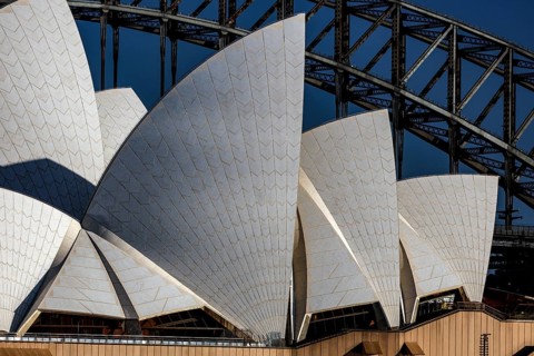 Detailed close-up of the Sydney Opera House façade in front of the bridge, Sydney, New South Wales,