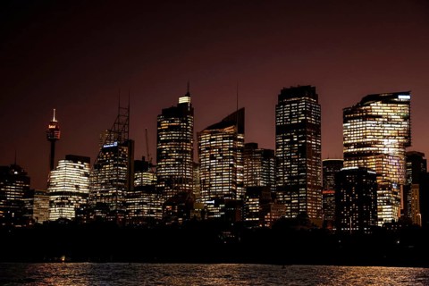 Sydney skyline illuminated at night with reflecting lights on skyscrapers, Sydney, New South Wales,