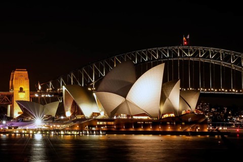 Illuminated Sydney Opera House and Harbour Bridge at night, Sydney, New South Wales, Australia