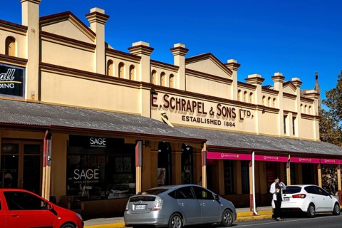 Historic building on Tanunda's main street with signs and shop windows, Tanunda, South Australia,
