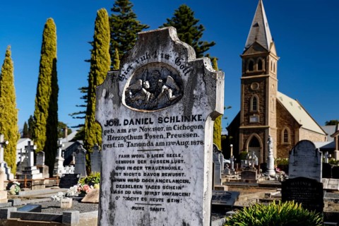 The Langmeil Lutheran cemetery with tombstones in front of a church in Tanunda, Tanunda, South