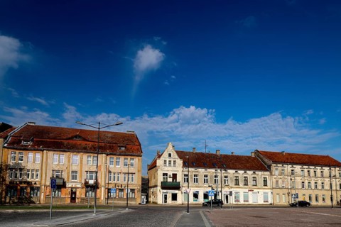 Historic buildings on a square under clear skies, Silute, LT