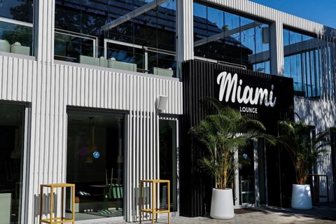 Modern bar with stylish façade and palm trees in front of the entrance, Pärnu, Pärnu County,