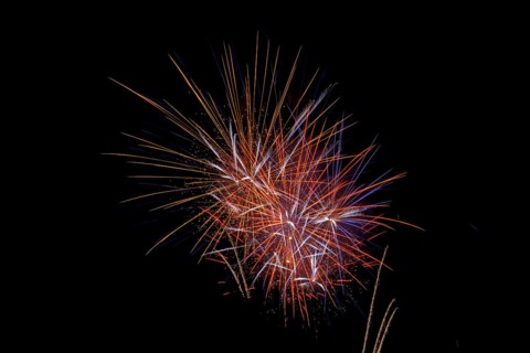 Fireworks in the night sky on New Year's Eve. Bad Salzschlirf, Hessen, Germany
