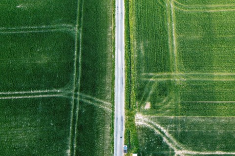 Vertical aerial view of fields intersected by a road, Osnabrücker Land, Wiehen Mountains, Lower