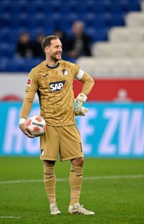 Goalkeeper Oliver Baumann TSG 1899 Hoffenheim (01) with match ball smiles PreZero Arena, Sinsheim,