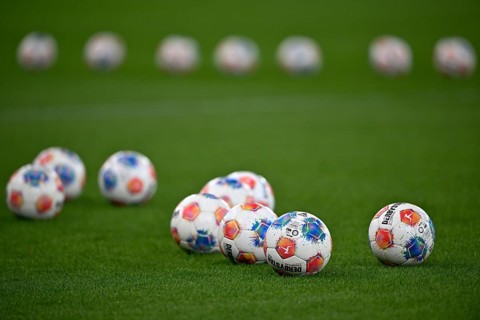 Adidas Derbystar game balls are lying on grass, PreZero Arena, Sinsheim, Baden-Württemberg, Germany