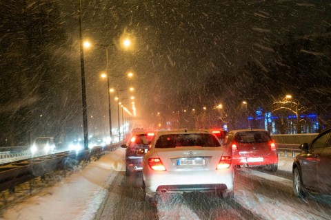 Traffic jam, city traffic due to snow flurries, blowing snow, Upper Bavaria, Germany