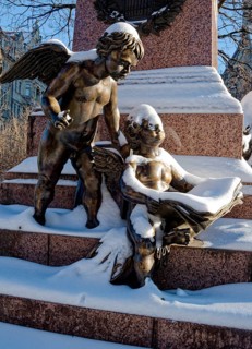 Two snowy angels, figure at the Felix Mendessohn Bartholdy monument in winter with snow, Leipzig,