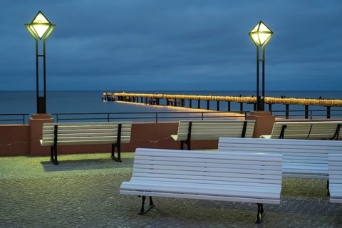 Kurplatz am spa hotel, in the back the pier and Baltic Sea, illuminated, Blaue Stunde, Binz,