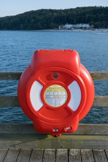Lifebuoy at the pier, Baltic Sea in the background, Binz, seaside resort, Rügen island,