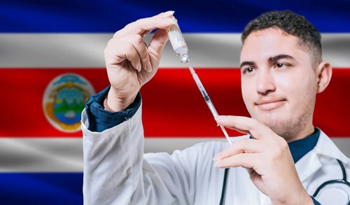 Doctor holding syringe on Costa Rica flag background. Medical professional holding syringe with