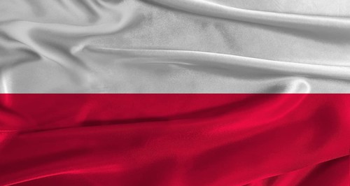 Flag of Poland with fabric textured background. Close up of National flag of Poland with realistic