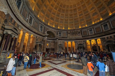 Tourist flow of visitors in Pantheon interior of ancient Roman temple with dome, coffered ceiling,