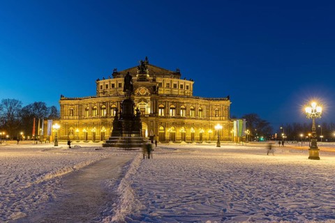 Illuminated Semper Opera House and Theatre Square with snow at dusk, Old Town of Dresden, Saxony,