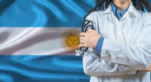 Healthcare professional with Argentina flag background. Professional doctor holding stethoscope on
