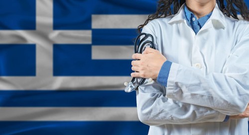 Healthcare professional with Greece flag background. Professional doctor holding stethoscope on