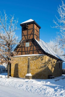 Timbered church in snowcoat with clear blue sky in background, Old Chapel, 15th century, snow,
