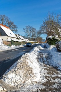 Snowy road, car, houses, winter, snow, Sieversen, Samtgemeinde Rosengarten, Lower Saxony, Germany