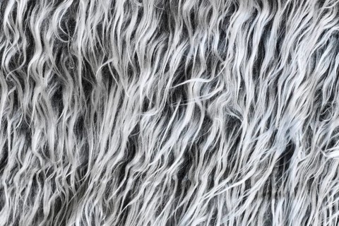 Close up of shaggy sheep-like gray synthetic fake fur