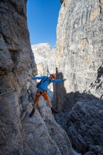 Mountaineers happy on the Via Ferrata Bocciere Centrale via ferrata, spectacular mountain landscape