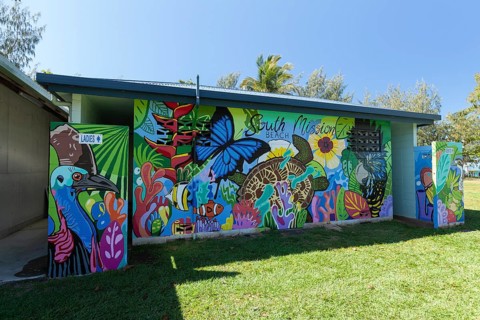August 19, 2020. Artistically painted public toilet block featuring nature murals in a tropical