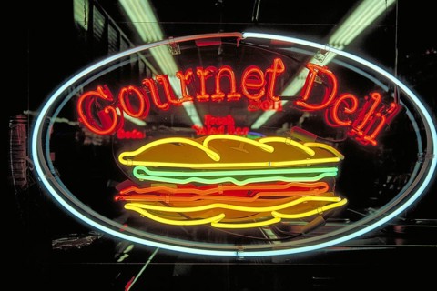 Illuminated advertising at an Indian restaurant, New York City, USA