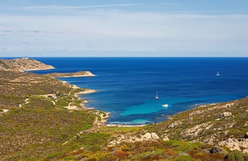 Coast at Punta de la Revellata, behind the lighthouse, Calvi, Haute Corse Department, Corsica,