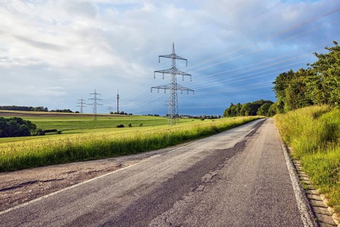 Landscape, road, high-voltage power line, high-voltage pole, television tower, fields, trees,