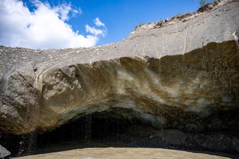 Meltwater at a glacier cave, underground glacier stream, Castner Glacier, Delta Range, Alaska