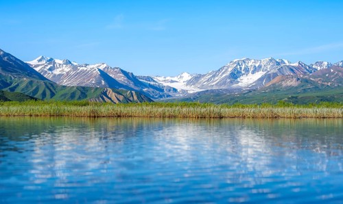 Lake and picturesque mountain landscape with Gulkana glacier and summit Icefall Peak, Richardson