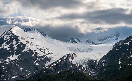 Mountain peak with Worthington Glacier glacier, dramatic cloudy sky, picturesque landscape on